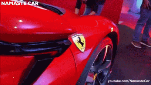 Red Ferrari with Namaste Car