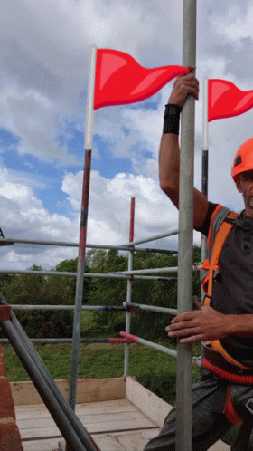 Man Dancing Red Flag Behind GIF