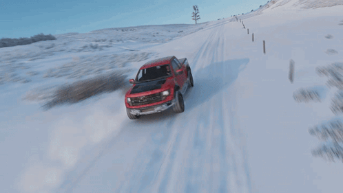 Red Ford Truck Drives Through Snow
