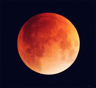 Red Full Moon Against Black Sky