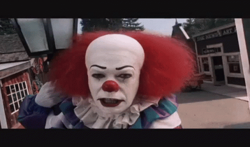 Red Hair White Face Clown at The News Art Building