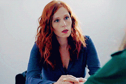 Red Hair Woman at Table With Another Woman