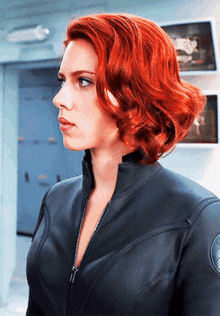 Red Hair Woman in Black Jacket Standing in Room
