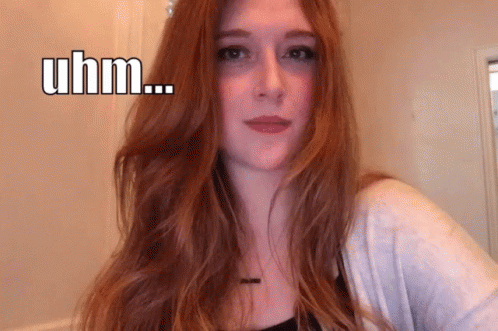 Red Hair Woman Making Funny Face Saying Uhm