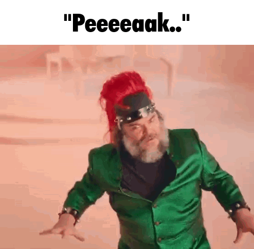 Red-Haired Bearded Man in Green Jacket Says Peeeeaak