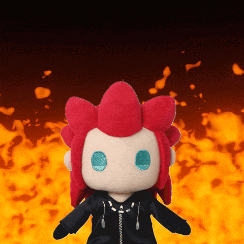 Red-haired Blue-eyed Stuffed Animal by Fire