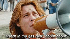 Red-Haired Man Holding Megaphone Says Match In Gas Tank Boom Boom