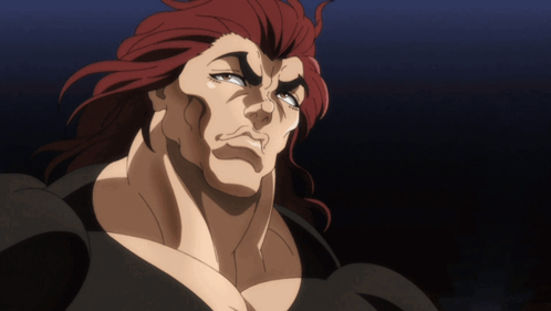 Red-Haired Man in Black Shirt Looking Down