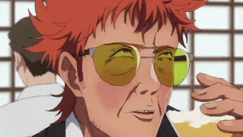 Red-Haired Man in Yellow Sunglasses Holding Beer