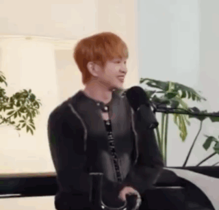 Red-Haired Man Talking Into Microphone