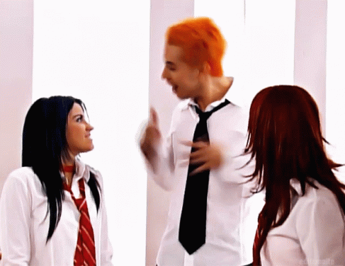 Red-Haired Man Talking to Two Women