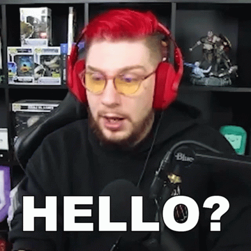 Red Haired Man with Headphones Saying Hello