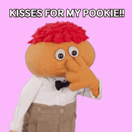 Red Haired Puppet Saying Kisses