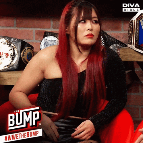 Red-Haired Woman at Diva Bible Sign
