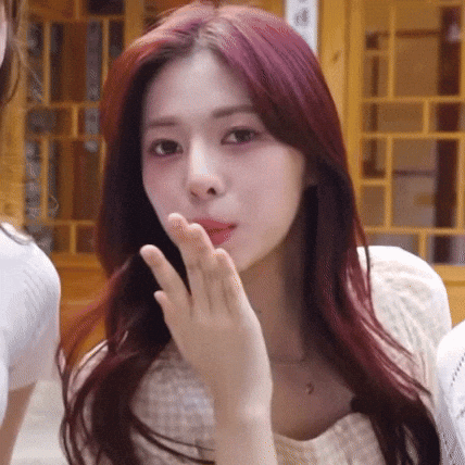 Red-Haired Woman Blowing A Kiss GIF