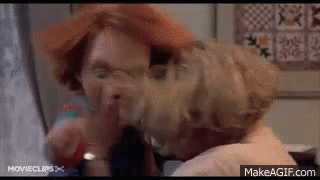 Red-Haired Woman Covers Face With Towel Another Woman Watches