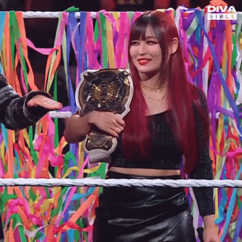 Red-Haired Woman Holding Diva Stable Trophy