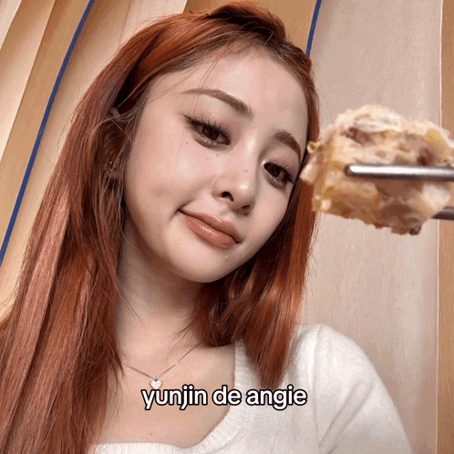 Red-Haired Woman Holding Food Yunjin De Angie