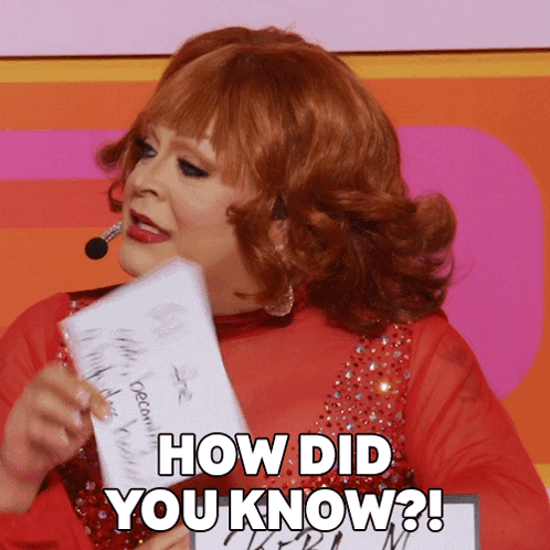 Red Haired Woman Holding How Did You Know Paper