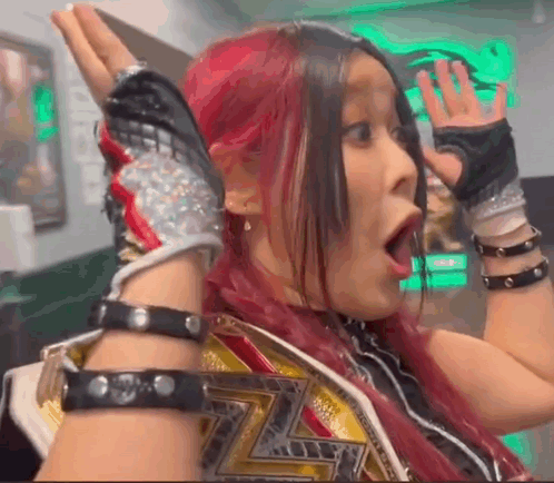 Red-Haired Woman in Wrestling Belt and Gloves Funny Face