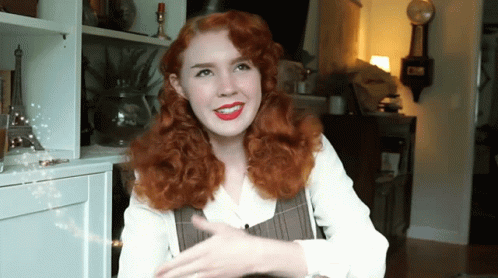 Red-Haired Woman Smiling At Clock Saying Clock GIF