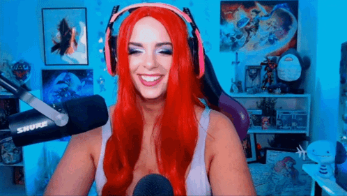 Red-Haired Woman Smiling At Microphone GIF