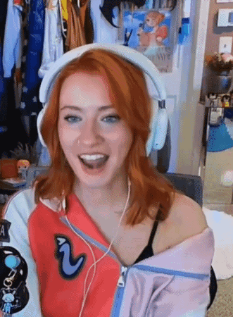 Red-Haired Woman Smiling in Headphones