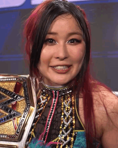 Red-Haired Woman Smiling With Gold and Silver Belt