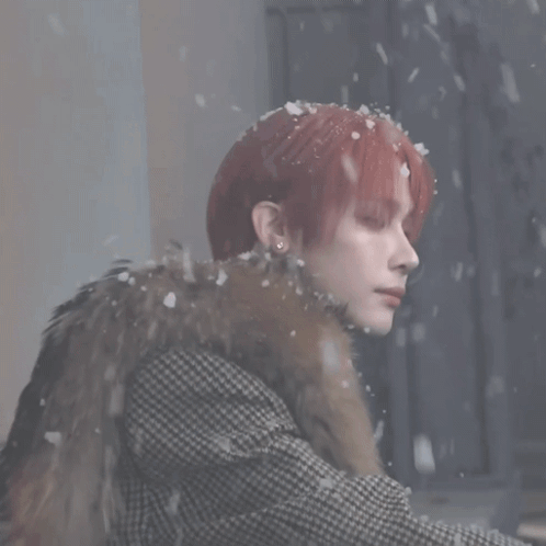 Red-Haired Woman Wearing Fur Coat In Snow GIF
