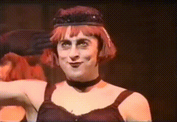 Red-Haired Woman With Black Hat and Choker