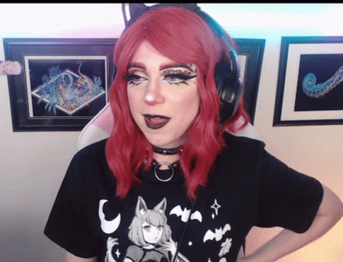 Red-Haired Woman With Headphones And Black T-Shirt GIF