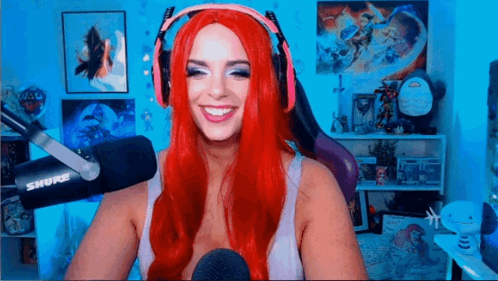 Red-Haired Woman With Headphones Smiling At Microphone GIF
