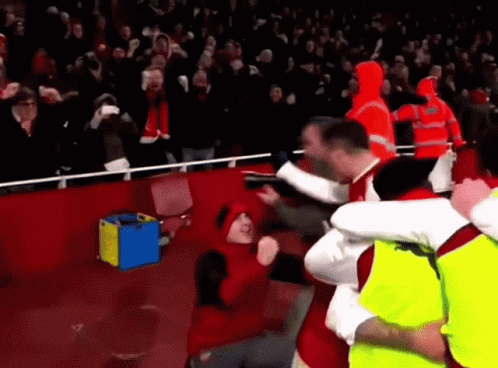 Red Hat Man Held by Yellow Vest Soccer