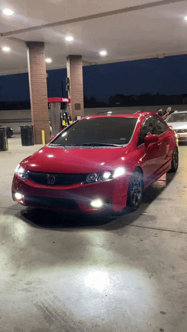 Red Honda Civic Parked at Gas Station at Night