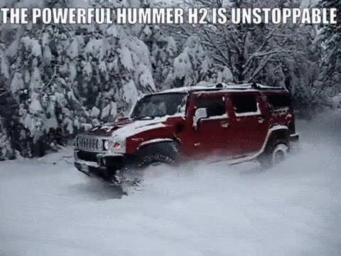 Red Hummer H2 Driving Through Snow