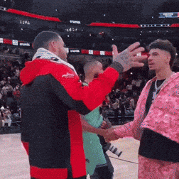 Red Jacket Man Shaking Hands With Pink Jacket Man GIF