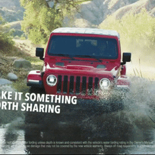 Red Jeep Driving Through Water