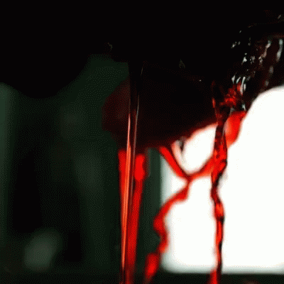 Red Liquid Pouring Into Glass GIF