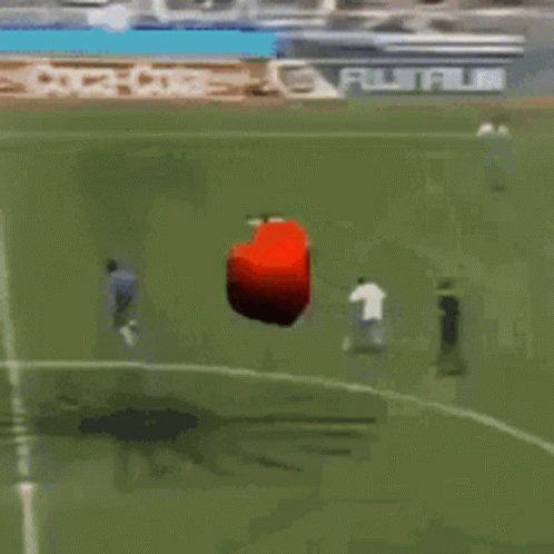 Red Object Flying Over Coca-Cola Soccer Field