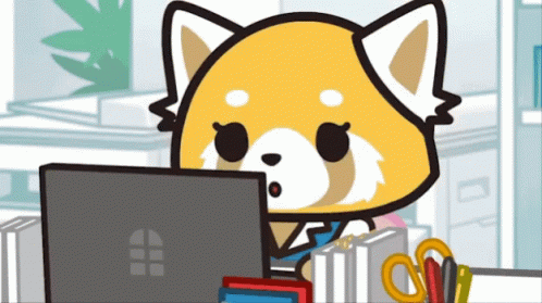 Red Panda Sitting at Desk Using Laptop
