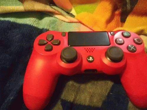 Red PlayStation Controller on Blanket