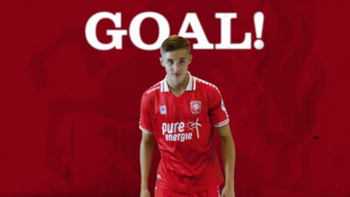 Red Pure Energie Soccer Player Pointing at Goal