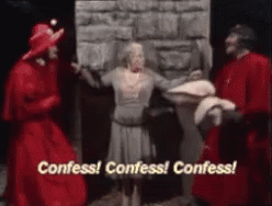 Red Robe Man Says Confess Gray Dress Woman