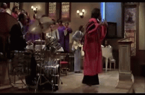 Red Robe Woman Dancing at Drum Set