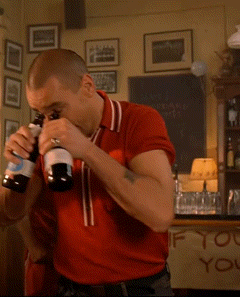 Red Shirt Man Drinking Two Beers