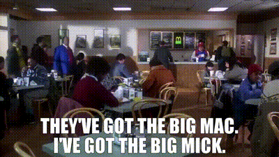 Red Shirt Man Next To Black Shirt Man GIF