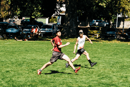Red Shirt Man Running to White Tank Top