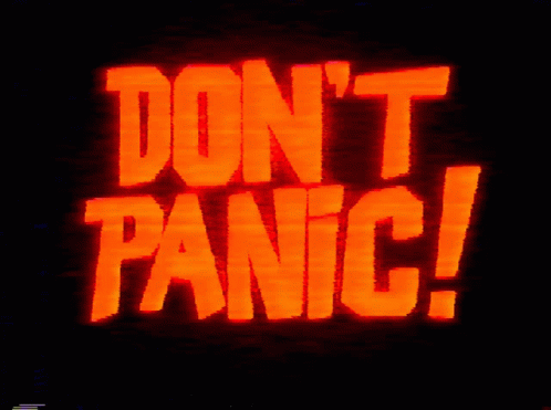 Red Sign Saying Don't Panic GIF
