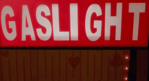 Red Sign Saying Gaslight 7 Lit Up