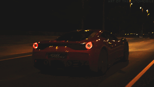 Red Sports Car Driving at Night